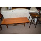 A mid 20th Century teak rectangular coffee table, the legs joined by an undertier,