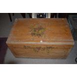 A late 19th/early 20th Century stripped pine blanket box, with later stencil decoration, 94cms wide.