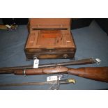 A 19th Century percussion rifle stained wood stock; a barrel of a gun numbered 885 and 1902;