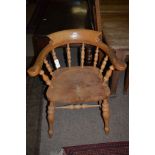 A 20th Century elm and ash Captains chair.