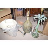 A modern pattinated lamp in the form of a palm tree; a pottery lamp;