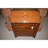 An Edwardian inlaid mahogany bureau, 76.5cms wide.