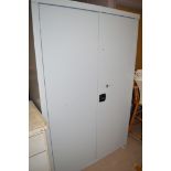 A grey metal filing cabinet, doors opening to reveal four shelves, 120cms.