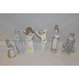 Lladro figures, to include: an angel; a boy yawning; girl with lamb; and three others.