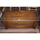 A mid 20th Century stained blanket box with carved decoration.