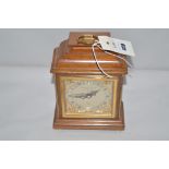 A modern mantel clock by Garrard & Co. Ltd., roman dial in mahogany case.