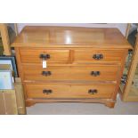 A late 19th Century walnut chest of two short and two long drawers, Art Nouveau handles,