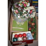 A box of Christmas decorations.