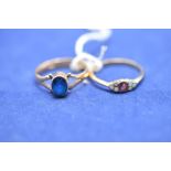 An 18ct yellow gold ruby and opal ring (missing one opal),