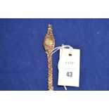 A 9ct yellow gold ladies wrist watch by Rotary (broken link), 16.7grms gross.