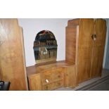 An Art Deco style walnut veneered bedroom suite, by Wrighton comprising: two wardrobes,
