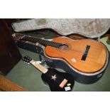 A BM Espana classical guitar, in fitted case; and a ukulele.