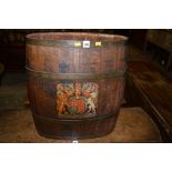 A 19th Century oak barrel brass bound with British crest.