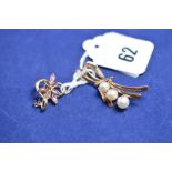 A 9ct yellow gold brooch set three cultured pearls;