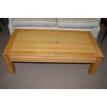 A modern oak rectangular coffee table, 125cms wide.