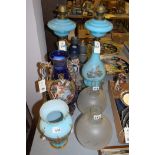 A pair of late 19th Century opaque blue glass oil lamps;
