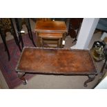 An Edwardian inlaid mahogany nest of tables; and a later walnut veneered rectangular coffee table,