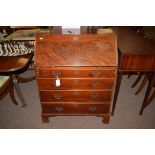 A 19th Century mahogany bureau, the fall-flap opening to reveal green baize,