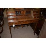 A reproduction mahogany Carlton House desk, fitted an arrangement of twelve drawers, 106.5cms.