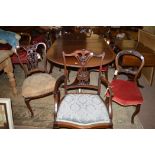 A set of five Victorian mahogany dining chairs, one carver and four singles,