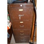 An early 20th Century wooden four drawer filing cabinet, 51cms wide.