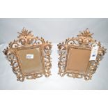 A pair of gilt metal photo frames.