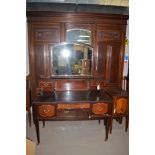 A late Victorian walnut wardrobe with central mirror, 199.5cms wide.