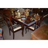 A modern stained wood draw leaf dining table, raised on cabriole legs, 150.