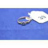 A single stone diamond ring illusion set, stamped "18", ring size N, 2.5grms gross.