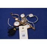 A quantity of wristwatches to include: three 9ct yellow gold ladies watches;