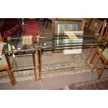 A modern rectangular bevelled glass top brass side table,