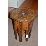 A 20th Century inlaid Middle Eastern octagonal occasional table, inset with abalone shell.