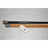 A Chinese malacca walking cane with white metal mount;