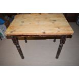 A late Victorian stripped pine and painted kitchen table with drop leaf to one side, 89.5cms wide.