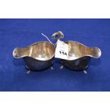 A pair of George V silver sauce boats by Walker & Hall, Sheffield 1935, 9.07ozs.