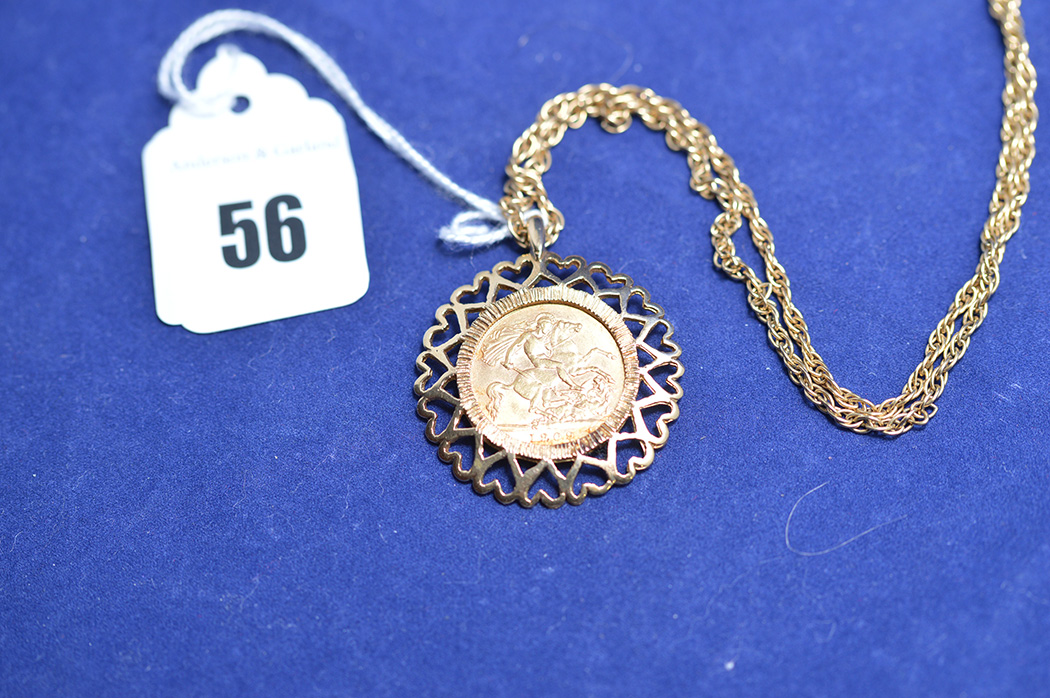 An Edward VII gold half sovereign 1909, in yellow metal pendant mount heart pattern design,