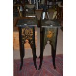 A pair of aesthetic movement style ebonised religious jardiniere stands, inlaid initials,