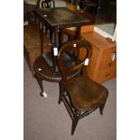 A Victorian stained oak balloon back dining chair; a circular occasional table;