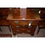 A mahogany chest of three drawers, raised on bracket feet and castors, 76cms wide.