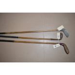 Three hickory shaft golf clubs, one made in Sunderland, registration no.41346; and two others.