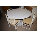 A white painted circular Arkana style table,