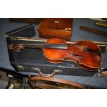 An early 20th Century violin, 'copy o Antonius Stradivarius' label, in fitted case.