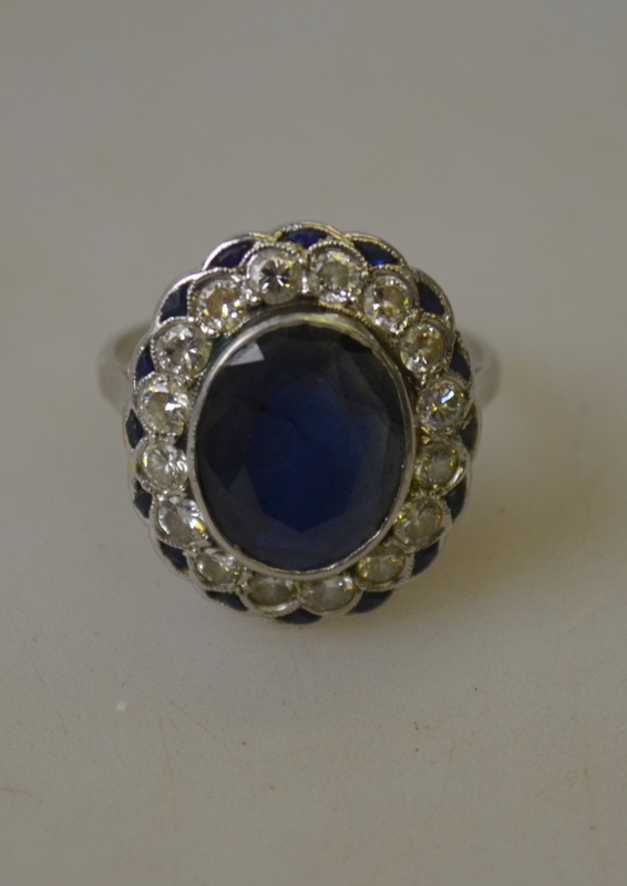An Art Deco ring having oval sapphire in