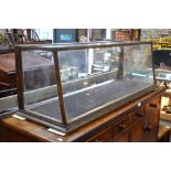 An antique glazed panel shop counter dis