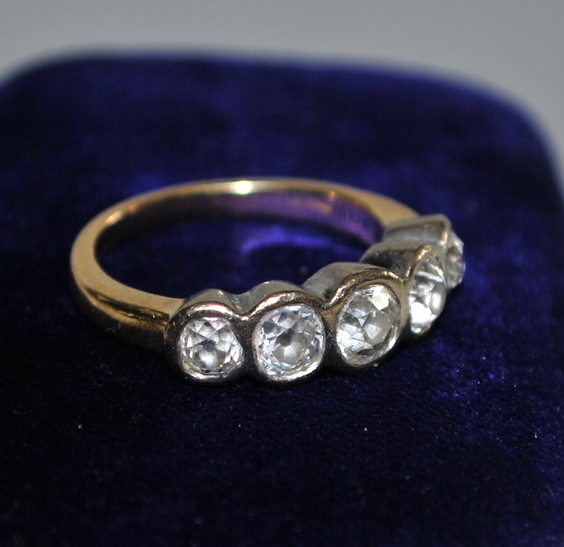 A five stone old cut diamond ring in whi