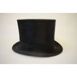 A vintage black silk top hat, size 7, 19