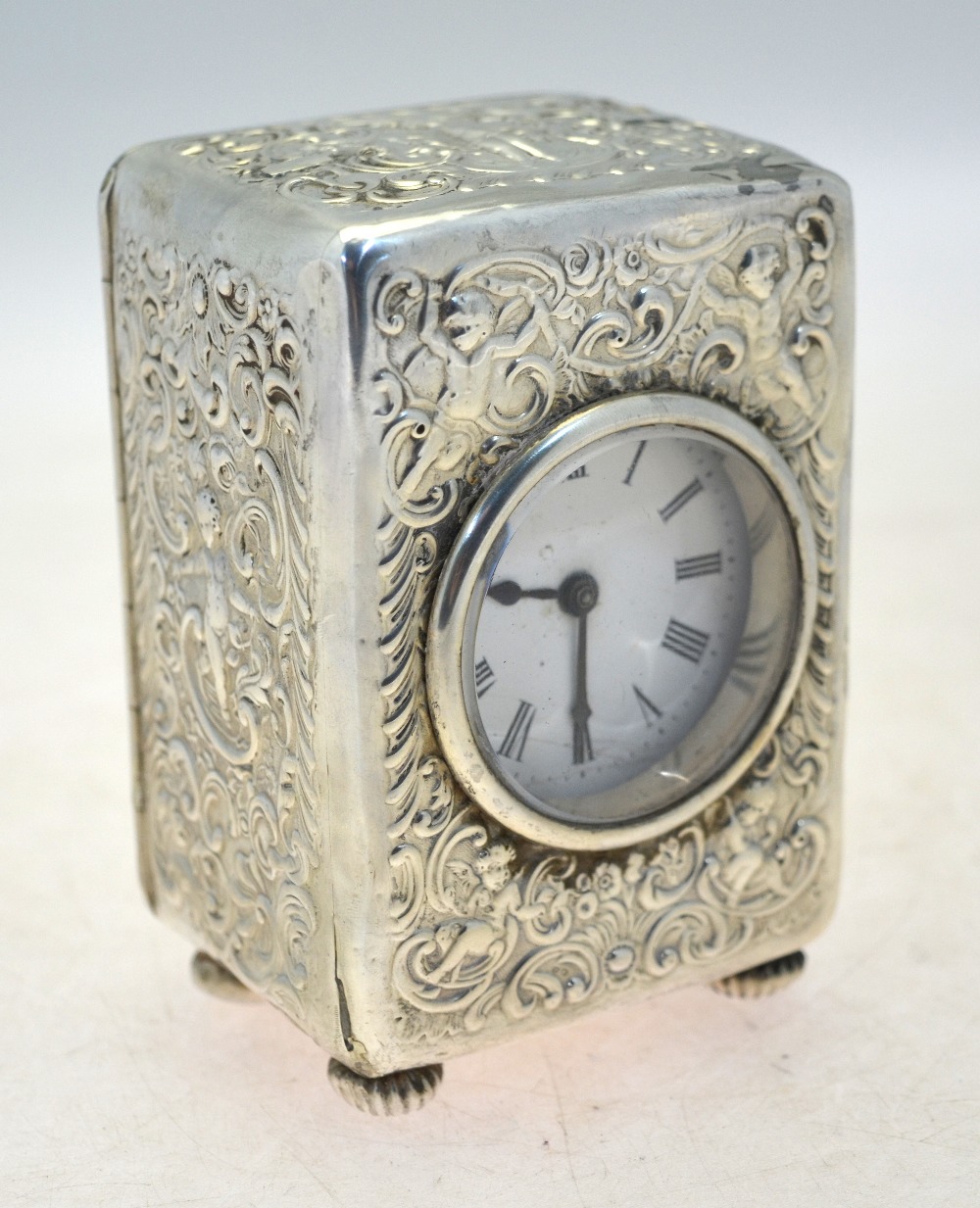 A late Victorian silver desk-clock, the