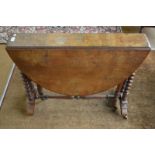 A Victorian walnut oval Sutherland tea table on twist supports