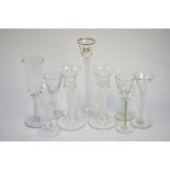 A collection of seven contemporary wine glasses with spiral twist stems to/w a pair of candle