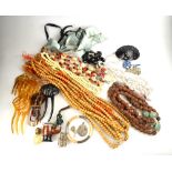 A collection of vintage jewellery including shell beads, wooden beads,